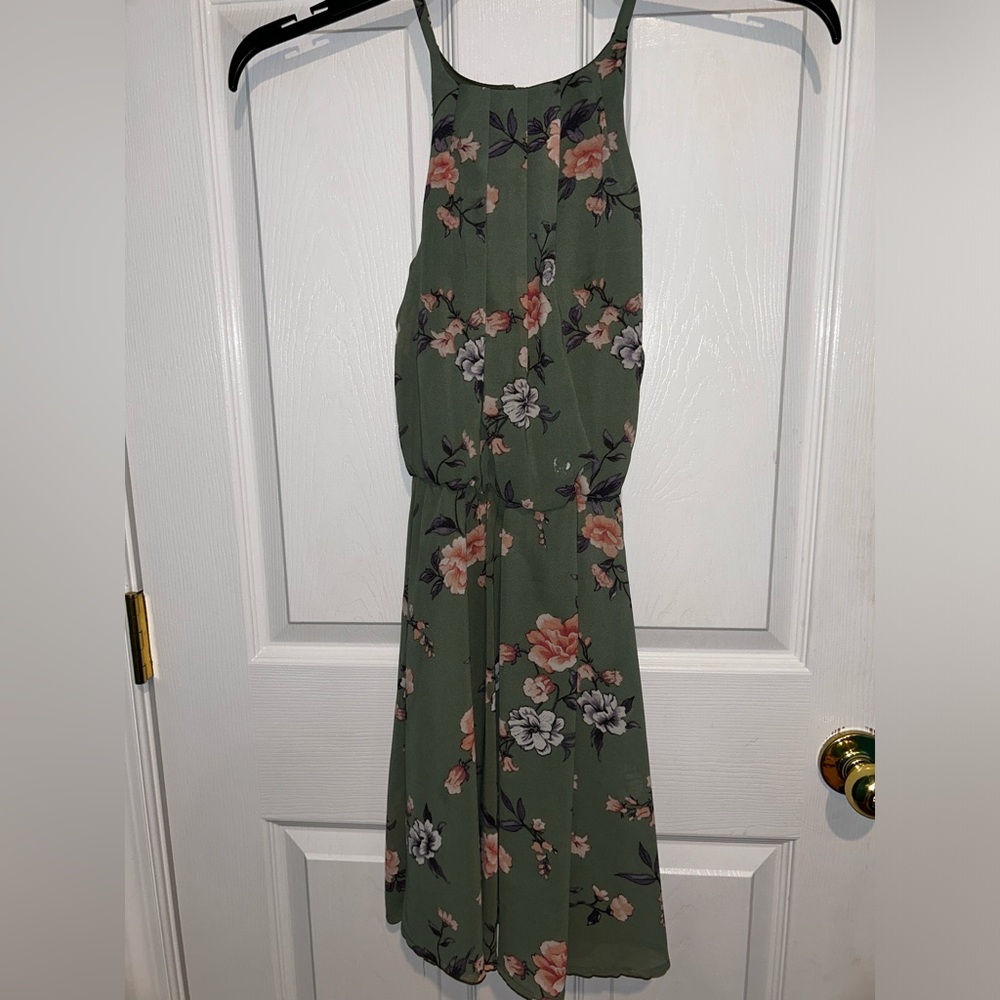 Green flowy floral dress, hugs a little around the waist